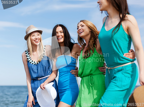 Image of girls walking on the beach