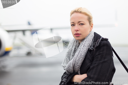 Image of Woman boarding airplain.