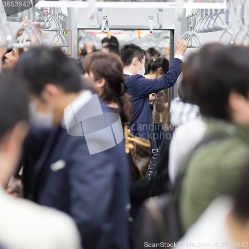 Image of Passengers traveling by Tokyo metro.