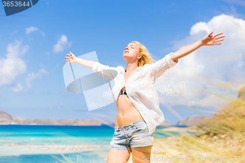 Image of Free Happy Woman Enjoying Sun on Vacations.