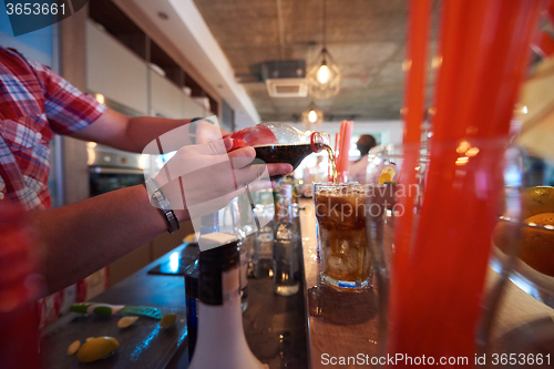 Image of barman prepare fresh coctail drink