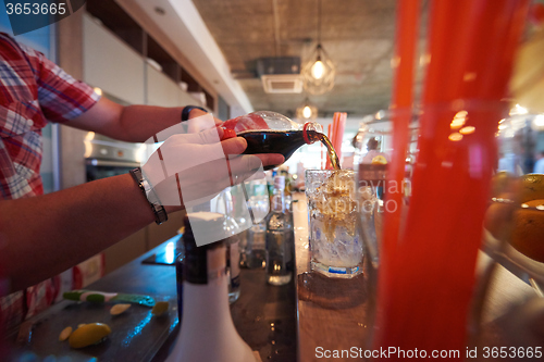 Image of barman prepare fresh coctail drink