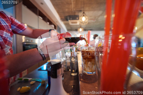 Image of barman prepare fresh coctail drink