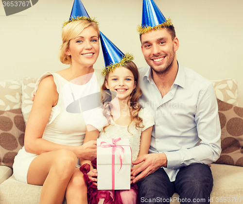 Image of happy family with gift box