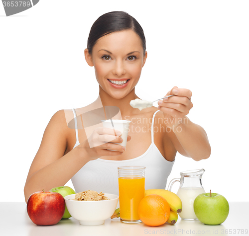 Image of woman with fruits and yogurt