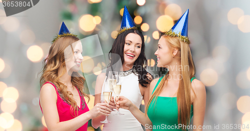 Image of smiling women holding glasses of sparkling wine