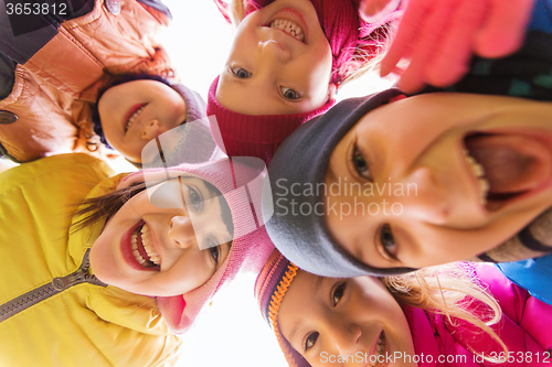 Image of group of happy children faces in circle