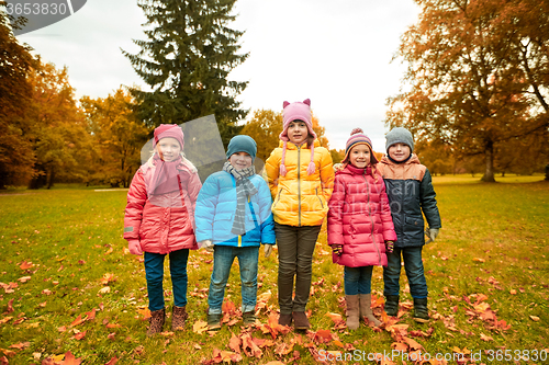 Image of group of happy children in autumn park