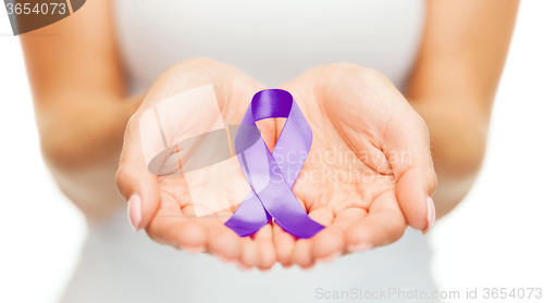 Image of hands holding purple awareness ribbon