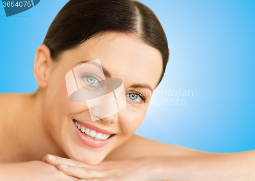 Image of beautiful smiling woman in spa salon