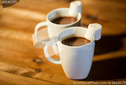 Image of cups of hot chocolate with marshmallow on wood