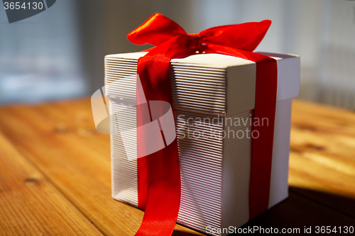 Image of close up of christmas gift box on wooden table