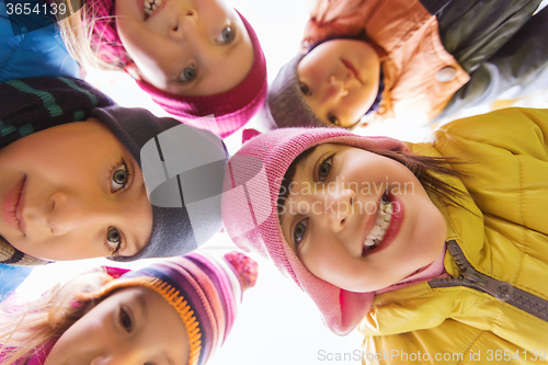 Image of group of happy children faces in circle