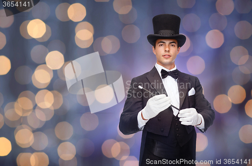 Image of magician in top hat with magic wand