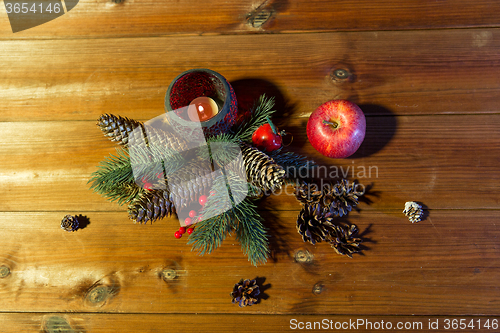 Image of christmas fir branch decoration and candle lantern