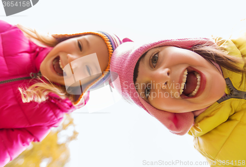 Image of happy laughing girls faces outdoors