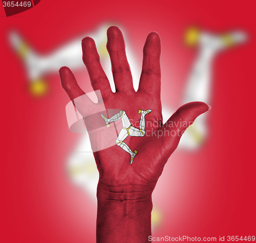 Image of Palm of a woman hand, painted with flag