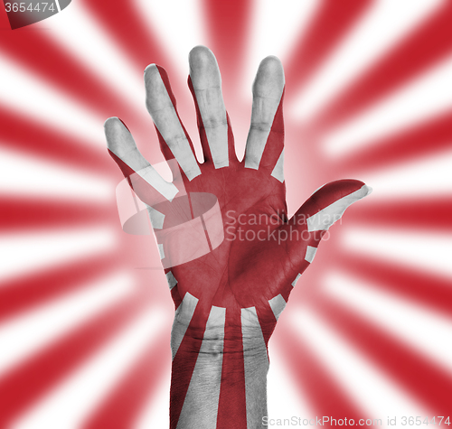 Image of Palm of a woman hand, painted with flag