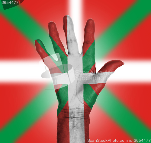 Image of Palm of a woman hand, painted with flag