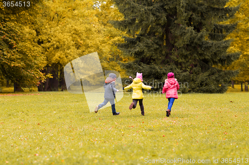 Image of group of happy little kids running outdoors