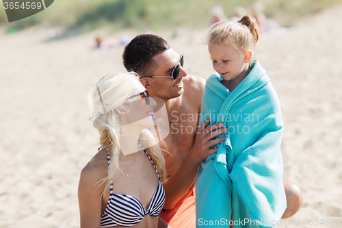 Image of happy family on summer beach
