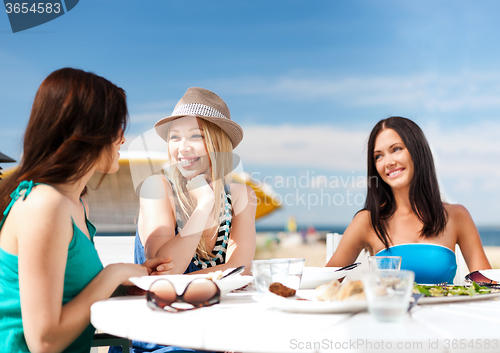 Image of girls in cafe on the beach