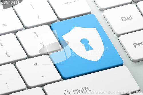 Image of Privacy concept: Shield With Keyhole on computer keyboard background
