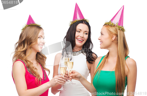 Image of three women in pink hats with champagne glasses