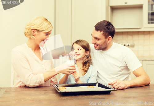 Image of happy family making cookies at home