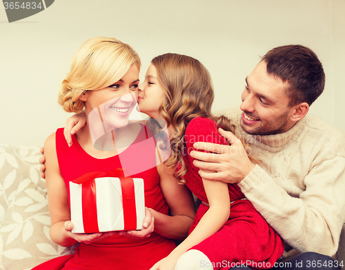 Image of adorable child kisses her mother