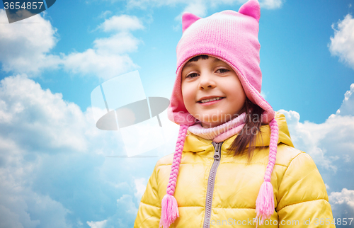 Image of happy beautiful little girl portrait over blue sky