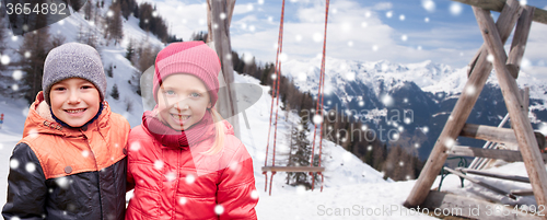 Image of happy little girl and boy over winter