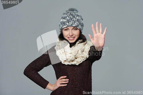 Image of Woman giving high five gesture