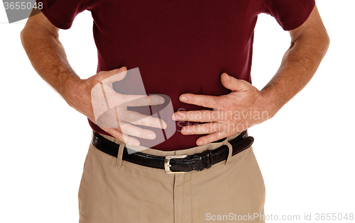 Image of Man holding his stomach for pain.