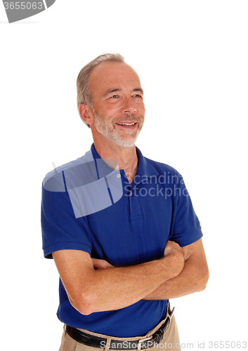 Image of Middle age man with arms grossed.