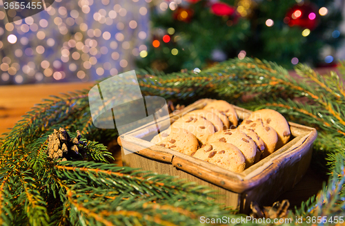 Image of natural green fir christmas wreath and oat cookies