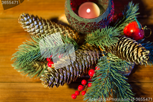 Image of christmas fir branch decoration and candle lantern