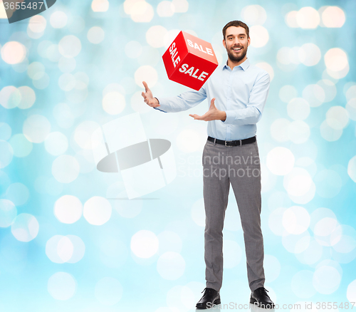 Image of smiling man with red shopping bag