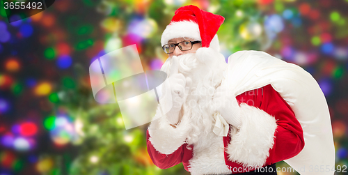 Image of man in costume of santa claus with bag