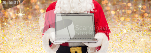 Image of close up of santa claus with laptop