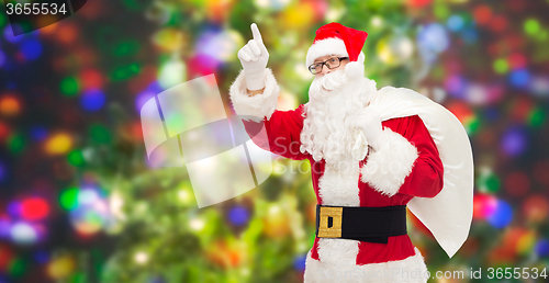 Image of man in costume of santa claus with bag