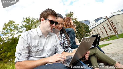 Image of students or teenagers with laptop computers