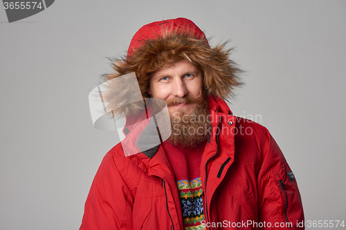 Image of bright picture of handsome man in christmas hat.