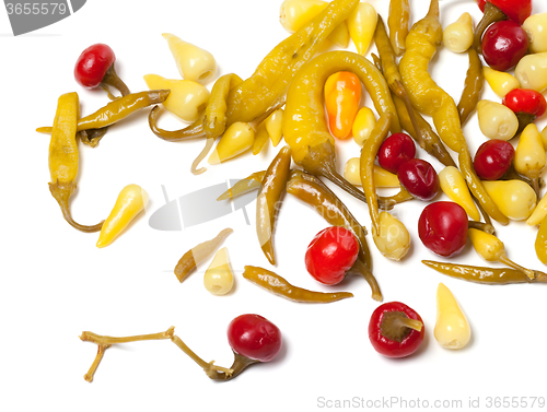 Image of Mix of hot pickled peppers on white background