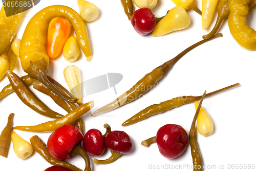 Image of Mix of hot marinated peppers on white background