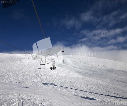 Image of Gondola and chair lift at ski resort in nice day
