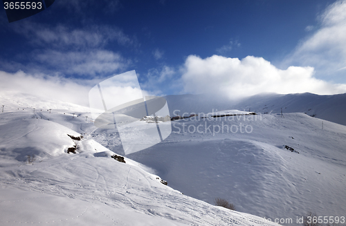 Image of Off-piste slope at sun morning