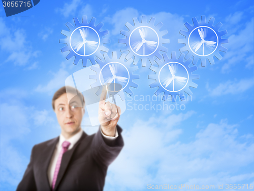 Image of Entrepreneur Looking At Wind Power Gear Train