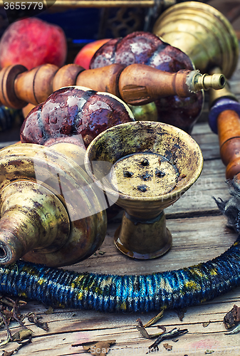 Image of Eastern hookah with fruit