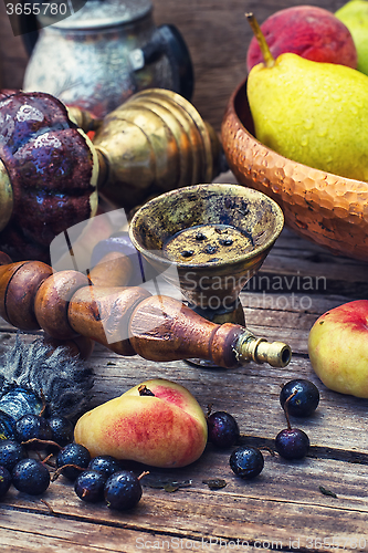 Image of Eastern hookah with fruit